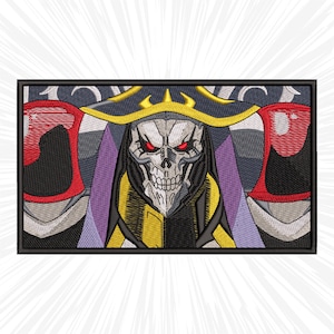 May include: Embroidered patch featuring a skull-faced character with red eyes, wearing a black and gold robe and a black hat with a gold trim. The character is surrounded by a purple and black background.