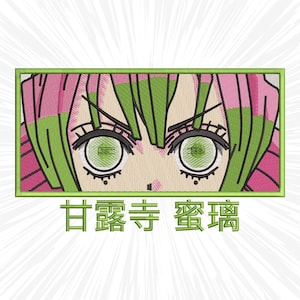 May include: Embroidered patch featuring a stylized anime character's eyes and hair. The design includes pink and green hair, large green eyes, and the character's face. The patch is framed in a green rectangle, with Japanese text below.