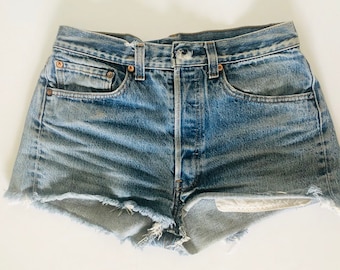 Vintage 80s Levi’s button fly cut off denim shorts S M