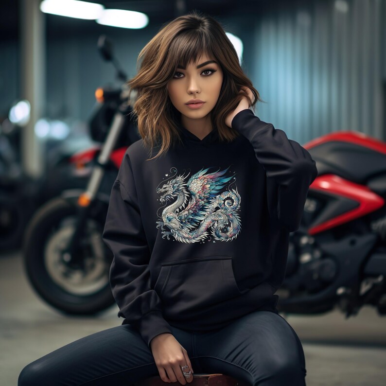 May include: Black hoodie with a colorful dragon graphic print. The dragon is detailed with intricate patterns and has a blue, purple, and pink color scheme.