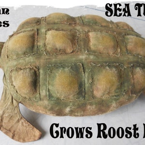 May include: A handcrafted sea turtle plush toy with a textured, patchwork design in shades of green and tan. The text "Ocean Series", "Sea Turtle", and "Grows Roost Prims" are displayed on the image.