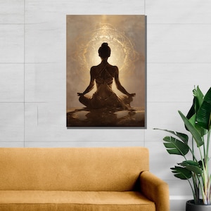 May include: A canvas print depicting a person in a meditative pose, silhouetted against a golden, circular design. The artwork features warm, earthy tones and a serene atmosphere, suitable for a meditation or yoga space.