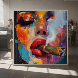 May include: Abstract art print of a face with red lips smoking a cigar. The artwork features bold brushstrokes in vibrant colors like orange, blue, and purple. The image is framed in a white border, suggesting a canvas or print.
