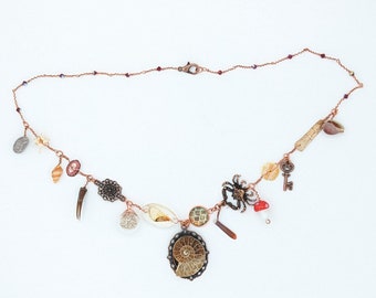 Curio Cabinet on a Charm Necklace with Ammonite Fossil Centerpiece and Red Bicone Beads