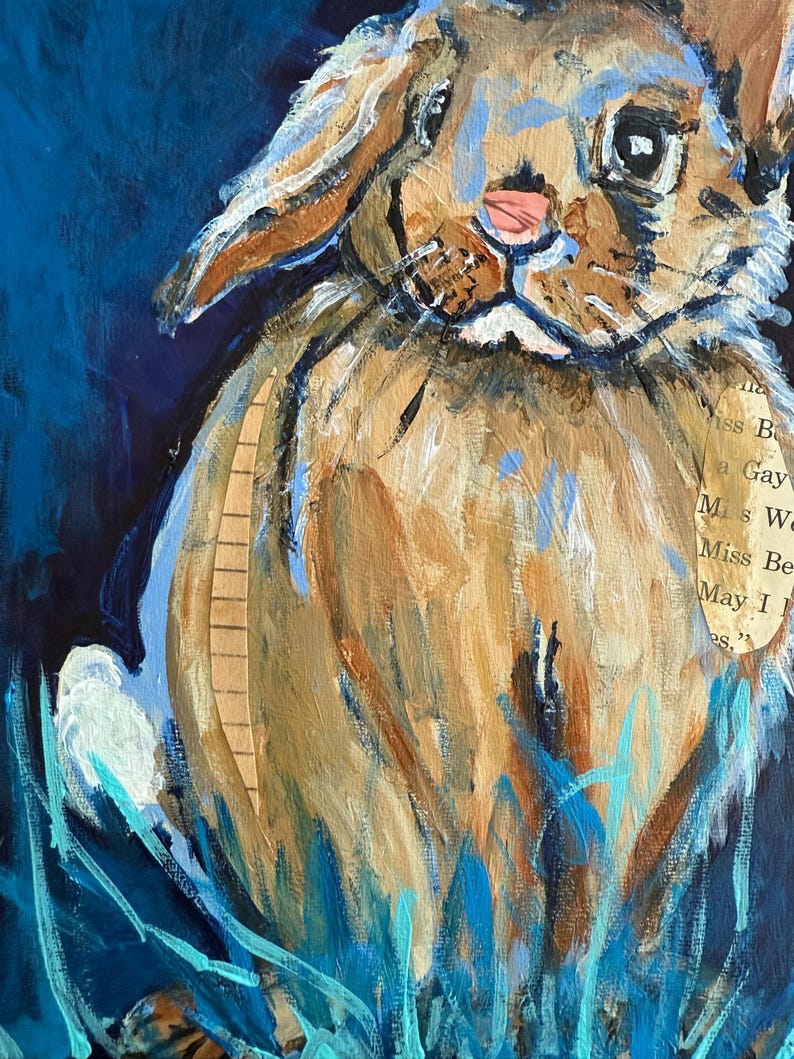 May include: A mixed media painting of a rabbit with brown fur, blue accents, and a pink nose. The rabbit is set against a dark blue background with blue and turquoise brushstrokes suggesting grass. A piece of paper with text is collaged on the rabbit.
