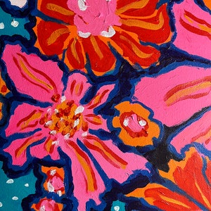 May include: A painting of pink and orange flowers with blue outlines on a teal background with white polka dots.