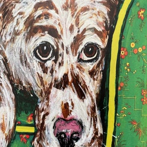 May include: A painting of a dog with brown and white fur, dark brown eyes, and a pink nose. The dog is positioned against a green background featuring a repeating pattern of small red and orange flowers with thin yellow lines framing the scene.
