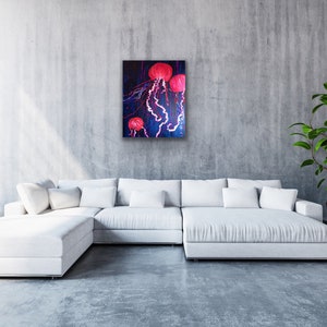 May include: A painting of three pink jellyfish with long, flowing tentacles against a dark blue background.