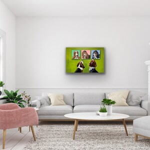 May include: A modern living room with a white wall, a gray sofa, and a pink armchair. Above the sofa, four framed dog portraits hang on a green background. A white coffee table and a white fireplace complete the room's decor.