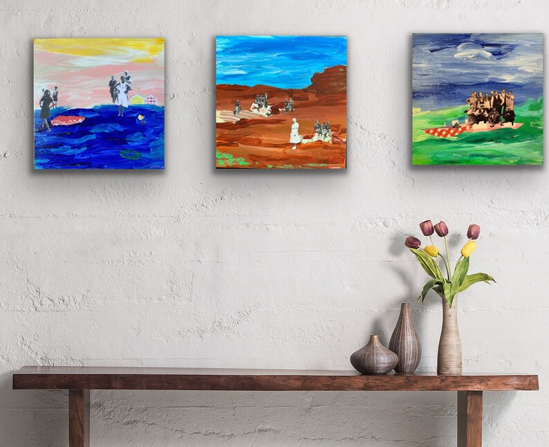 May include: Three framed paintings on a white wall, with a wooden table and a vase of flowers in front of them. The paintings are abstract and feature a variety of colors, including blue, green, red, and yellow.