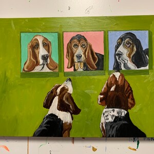 May include: Acrylic painting of three basset hounds in square frames against a green background. Two additional basset hounds are painted below the frames, looking up. The painting features brown, black, white, pink, and blue hues.