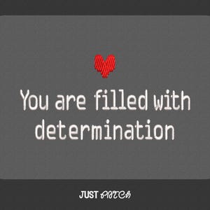 May include: A grey rectangular patch with rounded corners. The text "You are filled with determination" is embroidered in white. A small red heart is embroidered above the text. The words "JUST PATCH" are at the bottom.
