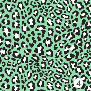 May include: A seamless pattern featuring a black and white leopard print on a light green background.
