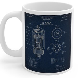 May include: A white ceramic mug featuring a dark blue patent print of an RCA Corporation 3-500Z power amplifier electron tube. The design includes technical diagrams labeled Fig. 1, Fig. 2, and Fig. 3, along with detailed pin connection text.