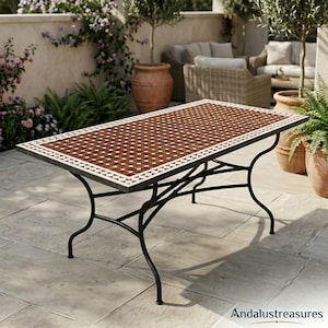May include: A rectangular outdoor table featuring a mosaic tile top with a deep brown centre and a white and brown geometric border pattern. The table is supported by a black metal frame with four curved legs connected by a central cross brace.