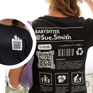 May include: Black t-shirt with white text that reads "BABYSITTER @Sue.Smith" and a QR code. The shirt also has three icons: a family, a heart, and a person holding a child.