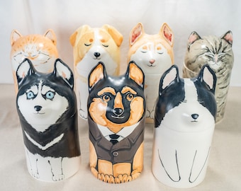 May include: Seven ceramic dog figurines, each with a different breed and expression. The figurines are painted in realistic colors and have a glossy finish.
