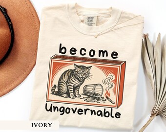 Become Ungovernable Shirt Funny Chaotic Cat Tee Vintage Matchbox Cat Shirt Sarcastic Feral Cat Meme Graphic Retro Humor Gift For Men Women