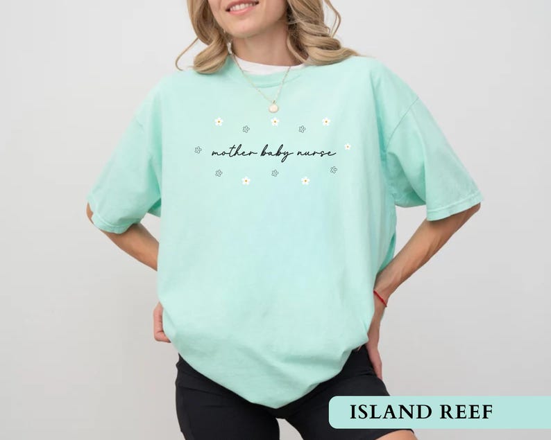 Mint green island reef cute NICU nurse gift t-shirt worn by a model showcasing the daisy graphic.