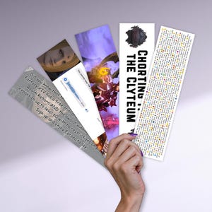 May include: A set of four rectangular paper bookmarks fanned out. One features a Final Fantasy XIV advertisement, another a voice message bubble, a third a fantasy character illustration, and the fourth text reading CHORTING THE CLYTEUM.