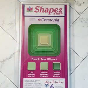 May include: A package of Spellbinders Shapez Creatopia dies for crafting. The package features a green frame die set with six different sizes. The package also includes the text "Frame 4 | Cadre 4 | Figura 4" and instructions for cutting, embossing, and stenciling. The package is labeled "Spellbinders 6 Dies Included".