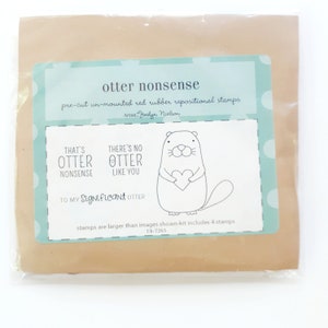May include: A set of four pre-cut unmounted red rubber repositional stamps featuring otter illustrations and the text "That's Otter Nonsense", "There's No Otter Like You", and "To My Significant Otter".