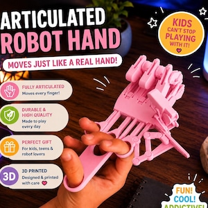 Puede incluir: Una mano robótica articulada rosa, diseñada para moverse como una mano real. La imagen incluye el texto "¡Los niños no pueden dejar de jugar con ella!" y "¡Se mueve como una mano real!"