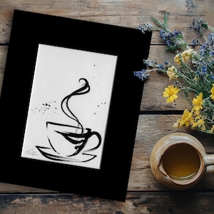 May include: A black and white ink wash painting of a steaming coffee cup on a saucer, presented within a thick black matting. The artwork features fluid, calligraphic brushstrokes depicting the cup and rising steam, with a signature in the corner.