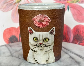 Kitty Kisses Cup - Hand thrown dark brown clay with hand drawn cat in white clay slip - Interior glaze is blue drips on white glaze