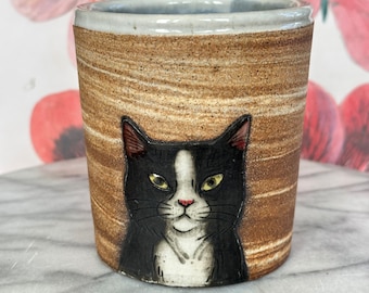 Kitty Kisses Cup - Hand thrown dark brown clay w/hand drawn tuxedo cat in white clay slip - Interior glaze is blue drips on white glaze