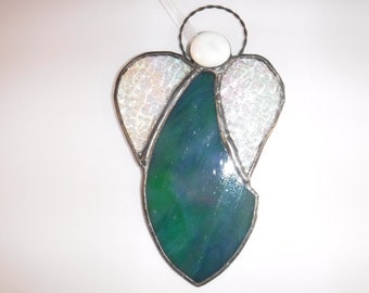 Lovely dark green with hints of pink and blue stained glass angels