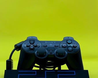 Soporte de exhibición para control de PS2 de Sony, color negro y azul. Soporte para control de Sony. Soporte de exhibición para control de PS2.