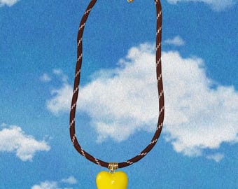 Brown paracord necklace with puffy yellow pastel heart