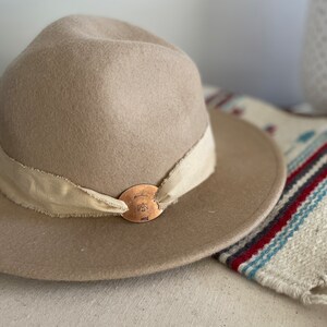 Stamped Thunderbird on Copper, Hat Medallion. With off white cotton ribbon. Hat accessory. Band