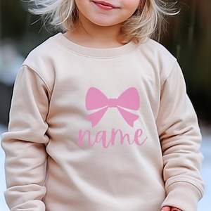 Felpa personalizzata con fiocco rosa per bambini - Felpa per bambini - Felpa per bambini - Girocollo personalizzato - Maglietta personalizzabile per bambini - T-shirt personalizzata per bambini