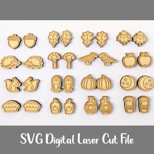 May include: A collection of laser-cut wooden shapes featuring autumn-themed designs. Includes acorns, leaves, mushrooms, birds, apples, hedgehogs, squirrels, owls, pumpkins, moons, pies, apple jars, maple syrup bottles, and coffee cups. The text "SVG Digital Laser Cut File" is at the bottom.