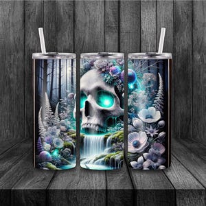 May include: Three stainless steel tumblers with a spooky skull design. The skull has glowing green eyes and is surrounded by flowers and a waterfall. Each tumbler has a white straw and a black lid.