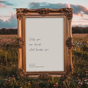 May include: A gold-framed print with the quote "Only you can decide what breaks you."  The quote is attributed to "The Suriel, A Court of Wings and Ruin".