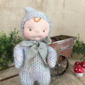 A Little Gnome Luvie in soft rainbow colors, light skin, a Waldorf doll with wire frame, child safe, ready to ship, available for adoption