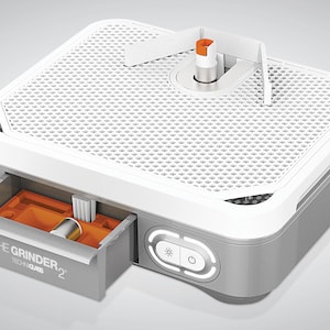 May include: A white and gray electric grinder with a clear plastic top and a drawer that says "THE GRINDER TECH + GLASS 2". The grinder has a power button and a light switch.