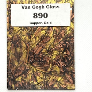 May include: A rectangular sheet of Van Gogh Glass, style 890, featuring a metallic copper and gold textured pattern. A white label is centered at the top with the black text: Van Gogh Glass, 890, Copper, Gold. The surface has a reflective finish.