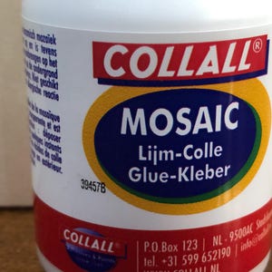 May include: A white bottle of Collall Mosaic glue with a red and blue label. The label features the word "MOSAIC" in large white letters on a blue background, with "Lijm-Colle Glue-Kleber" below. The bottle also has text in Dutch and French.