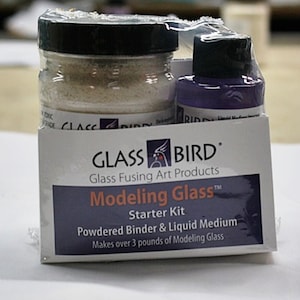 May include: Glass Bird Modeling Glass Starter Kit with a jar of powdered binder and a bottle of liquid medium. Makes over 3 pounds of modeling glass.