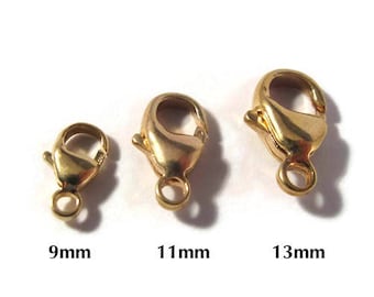 May include: Three gold-toned lobster clasps in different sizes: 9mm, 11mm, and 13mm. These clasps are commonly used for jewelry making.