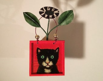 original cat art, sandy mastroni, tuxedo cat   3 inches wide , 6 inches tall  , flowers , leaves , red and black