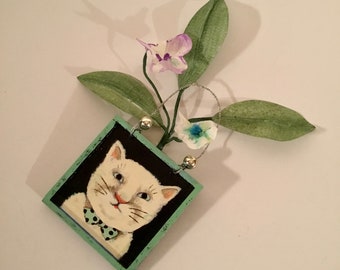 original cat art, sandy mastroni, white cat   3 inches wide , 6 inches tall  , flowers , leaves , soft colors