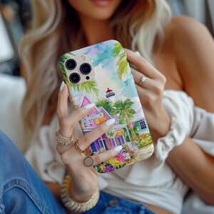 Vibrant tropical street scene phone case showcasing colorful Key West architecture and greenery.