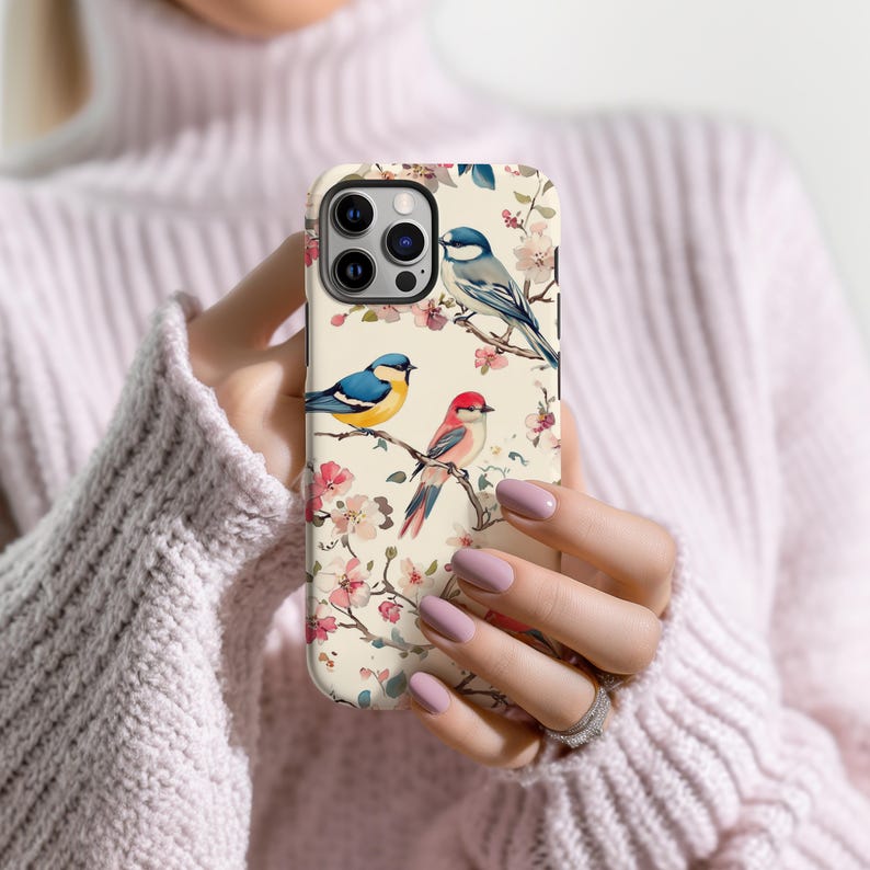 Aesthetic pastel phone case with vibrant birds and floral details, perfect for nature lovers.