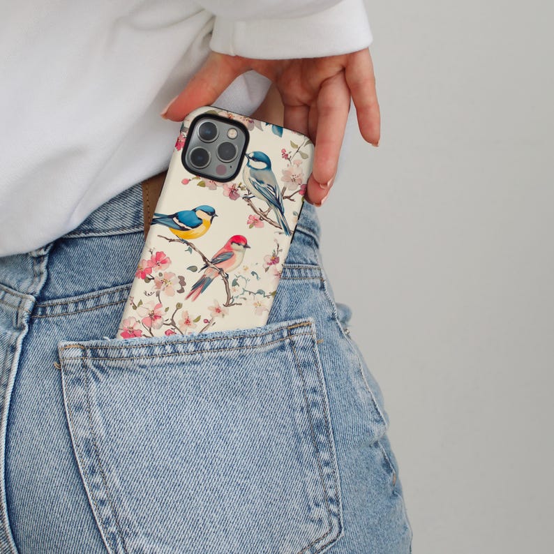 Close-up of delicate watercolor birds on cherry blossom branches, a vintage-inspired spring phone case.