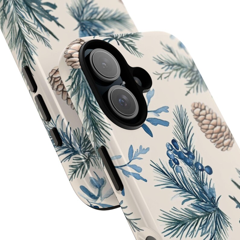 May include: A white phone case with a watercolor design of pine branches and pine cones in shades of blue, green, and brown.